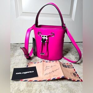 Stylish bucket bag in vibrant pink, made of textured leather.Used 3 times.